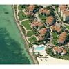 <p class="MsoNoSpacing" style="margin: 0in 0in 0pt"><font color="#000000"><span style='font-family: "arial","sans-serif"; font-size: 10pt'>As another Fisher Island condo boasting glorious waterfront views in an already highly exclusive, upscale and extremely private community, Seaside Villas is another superb option if you’re looking for an all inclusive condo and townhouse option that allows you the privilege of living in this nationally recognized island neighborhood.&nbsp; </span><span lang="EN-GB" style='font-family: "arial","sans-serif"; font-size: 10pt; mso-ansi-language: en-gb'>This Mediterranean inspired condo/hotel development is situated on the S.E. corner of Fisher Island in Miami.&nbsp; The project consists of 45 exclusive oceanfront units with accompanying free form pool and coquina limestone recreation deck.</span><span lang="EN-GB" style='font-family: "arial","sans-serif"; font-size: 10pt'> </span><span style='font-family: "arial","sans-serif"; font-size: 10pt'><span style="mso-spacerun: yes">&nbsp;</span>Seaside Villa is a luxurious and comfortable nest offering privacy and serenity in a sumptuous tropical garden paradise minutes away from vibrant South Beach and the exciting city of Miami.<span style="mso-spacerun: yes">&nbsp; </span>With unspoiled beaches and balmy ocean breezes it is&nbsp;the perfect place to escape, to invigorate, to unwind…
<o:p></o:p></span></font></p>
<p class="MsoNoSpacing" style="margin: 0in 0in 0pt"><span style='font-family: "arial","sans-serif"; font-size: 10pt'>
<o:p><font color="#000000">&nbsp;</font></o:p></span></p>
<p class="MsoNoSpacing" style="margin: 0in 0in 0pt"><span style='font-family: "arial","sans-serif"; font-size: 10pt'><font color="#000000">Seaside Villas Condos consist of one, two and three story buildings that face the marina and the southeast view of the Atlantic Ocean.<span style="mso-spacerun: yes">&nbsp; </span>Built in 1988, these amazing residences have all the amenities and features of a five-star resort, and are now available for sale or for rent.<span style="mso-spacerun: yes">&nbsp; </span>Seaside Villas offers just forty-five residences on two and three floors with four different floor plans ranging in size from 670 to 1,670 square feet.<span style="mso-spacerun: yes">&nbsp; </span>These are configured in one and two bedroom designs.<span style="mso-spacerun: yes">&nbsp; </span>The Seaside Villas offers the perfect getaway apartment on Fisher Island.<span style="mso-spacerun: yes">&nbsp; </span>For those who like to globetrot or use Miami as their vacation hotspot of choice, the Seaside Villas offers a hotel program allowing owners to rent their units out while they’re being unoccupied, a great way to make some extra money and allow others to experiences the comfort of lodging in Fisher Island.<span style="mso-spacerun: yes">&nbsp; </span>If you have the privilege of living in Fisher Island, you’re already living like royalty and the interior of Seaside Villas residences more than reinforce that image.<span style="mso-spacerun: yes">&nbsp; </span>Beautiful marble floors, expansive balconies, Spanish inspired exteriors with stucco walls, breakfast bars, kitchens with all appliances included and plenty more await you in these wonderful units.
<o:p></o:p></font></span></p>
<p class="MsoNoSpacing" style="margin: 0in 0in 0pt"><span style='font-family: "arial","sans-serif"; font-size: 10pt'>
<o:p><font color="#000000">&nbsp;</font></o:p></span></p>
<p class="MsoNoSpacing" style="margin: 0in 0in 0pt"><b style="mso-bidi-font-weight: normal"><span style='font-family: "arial","sans-serif"; color: #e36c0a; font-size: 10pt; mso-themecolor: accent6; mso-themeshade: 191'><a shape="rect" href="http://www.condosandcondos.com/Fisher-Island.aspx"><span style="color: #e36c0a; mso-themecolor: accent6; mso-themeshade: 191">Fisher Island</span></a></span></b><font color="#000000"><span style='font-family: "arial","sans-serif"; font-size: 10pt'> is a 216-acre private island residential community of unrivaled luxury and splendor. Residents, Club members and Hotel &amp; Resort guests enjoy a host of sumptuous amenities including The Fisher Island Hotel &amp; Resort, voted as Miami's Best Hotel<span style="mso-spacerun: yes">&nbsp; </span>by Zagat's Survey.<span style="mso-spacerun: yes">&nbsp; </span>Originally built in the 1920's by William and Rosamund Vanderbilt as their splendid winter estate, Fisher Island has enjoyed a long history of entertaining the luminaries of its time.<span style="mso-spacerun: yes">&nbsp; </span>Fisher Island has been restored to its former grandeur and, in the process; it has become a world-class residential community.<span style="mso-spacerun: yes">&nbsp; </span>Although no longer a one-family island, Fisher Island still remains somewhat inaccessible to the public and uninvited guests and exclusive by modern standards as it was in the days of the Vanderbilt's, providing similar refuge and retreat for its residents.</span><span new="" times="" roman??="" style='font-family: "arial","sans-serif"; font-size: 10pt; mso-fareast-font-family: ; mso-bidi-font-weight: bold'><span style="mso-spacerun: yes">&nbsp; </span>Fisher Island</span><span new="" times="" roman??="" style='font-family: "arial","sans-serif"; font-size: 10pt; mso-fareast-font-family: '>, known as the “America’s Richest Community”, is located just off Miami Beach between Biscayne Bay and Atlantic ocean and is the most luxurious and exclusive island community in the world.<span style="mso-spacerun: yes">&nbsp; </span>This spectacular island community is currently home to some of the most famous and richest people in the world.<span style="mso-spacerun: yes">&nbsp; </span>Some of the famous current and past residents include <span style="mso-bidi-font-weight: bold">Oprah Winfrey</span>, Andre Agassi, Boris Becker, <span style="mso-bidi-font-weight: bold">Julia Roberts</span>, and Ricky Martin.
<o:p></o:p></span></font></p>
<p class="MsoNoSpacing" style="margin: 0in 0in 0pt"><span style='font-family: "arial","sans-serif"; font-size: 10pt'>
<o:p><font color="#000000">&nbsp;</font></o:p></span></p>
<p class="MsoNoSpacing" style="margin: 0in 0in 0pt"><span style='font-family: "arial","sans-serif"; font-size: 10pt'>
<o:p><font color="#000000">&nbsp;</font></o:p></span></p>
<p class="MsoNoSpacing" style="margin: 0in 0in 0pt"><span style='font-family: "arial","sans-serif"; font-size: 10pt'><font color="#000000">Seaside Villas on private Fisher Island are only accessible by private ferry. <span style="mso-spacerun: yes">&nbsp;</span>Residences are only steps from the open ocean, beach and amazing ocean front pool with coral steps leading to your own private white sand beach.<span style="mso-spacerun: yes">&nbsp; </span>It's a picture perfect vision, a beach house in a setting away from the world but 20 minutes from the excitement of Miami.<span style="mso-spacerun: yes">&nbsp; </span>White, bright, coral floors, patio- garden to sit outside surrounded by bougainvilleas and view of the ocean.<span style="mso-spacerun: yes">&nbsp; </span>Professionally decorated and a golf cart is included to ride around the island.<span style="mso-spacerun: yes">&nbsp; </span>The Fisher Island Beach Club is right across the street from Seaside Villas as well as hundreds of miles of beachfront to sunbathe and frolic in.<span style="mso-spacerun: yes">&nbsp; </span>Alternatively, you can head out just a few short minutes away to the infamous South Beach area and party ‘til daybreak at the popular bars and clubs on nationally recognized Ocean Drive and always trendy Lincoln Road.<span style="mso-spacerun: yes">&nbsp; </span>For the ultimate oceanfront living experience, make Seaside Villas your new getaway destination home!
<o:p></o:p></font></span></p>